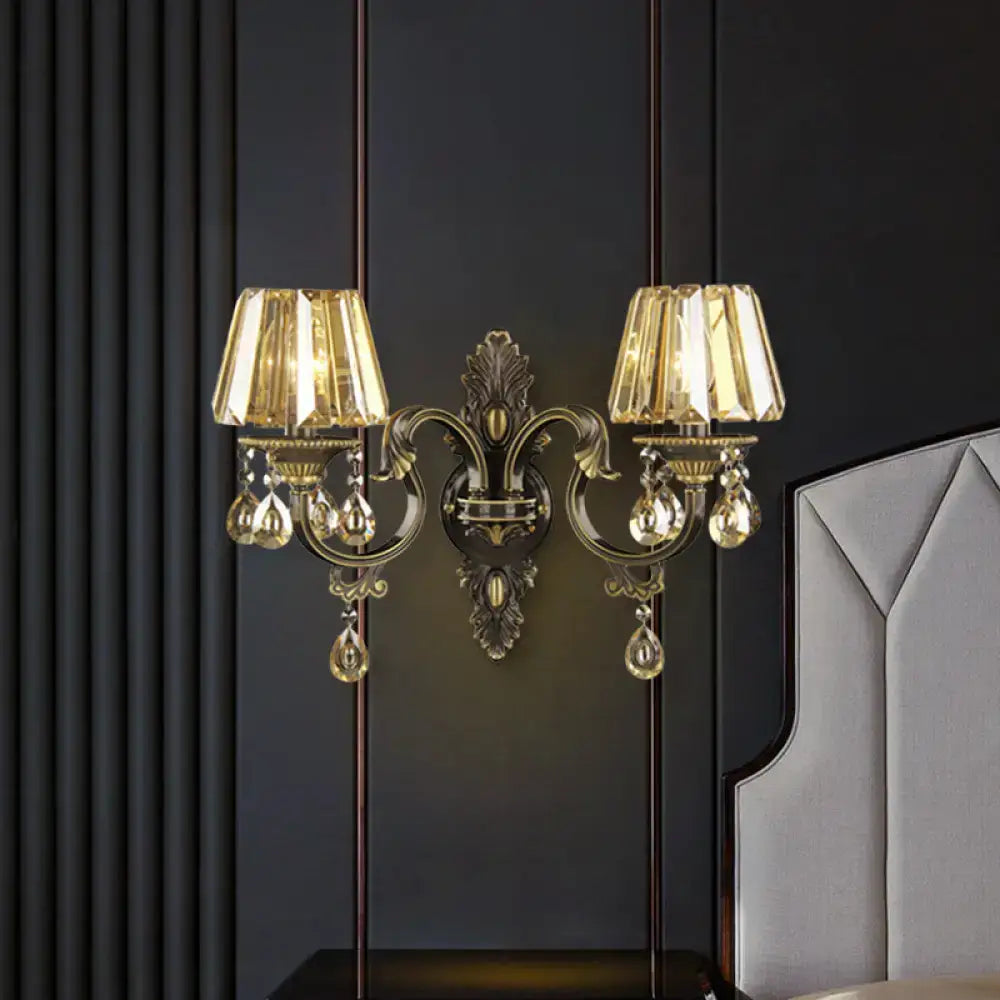 Modern gold crystal teardrop living room wall sconce with ornate design and two crystal-encrusted lampshades