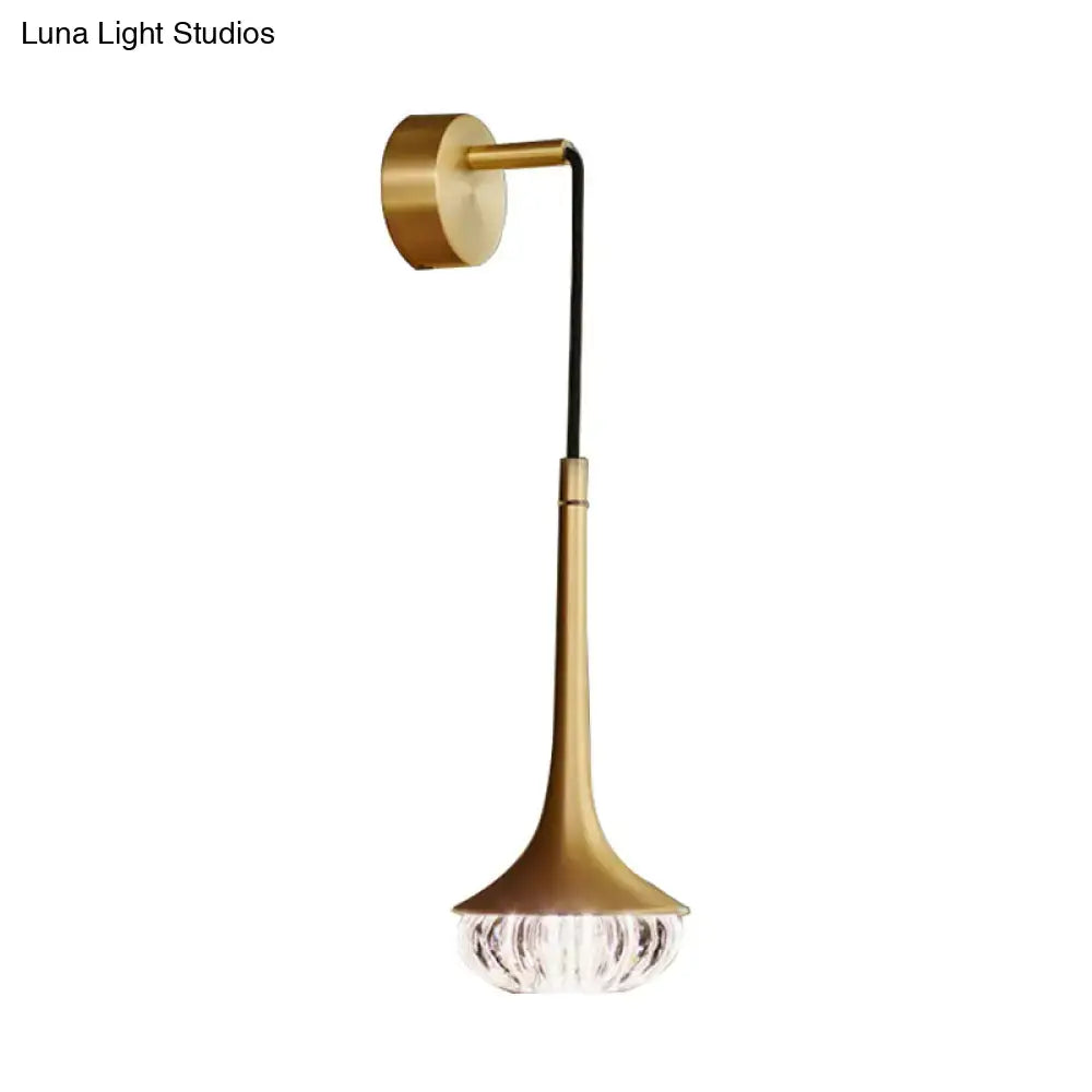 Modern gold crystal wall lamp featuring a gold-toned trumpet-shaped metal body with a faceted crystal glass shade