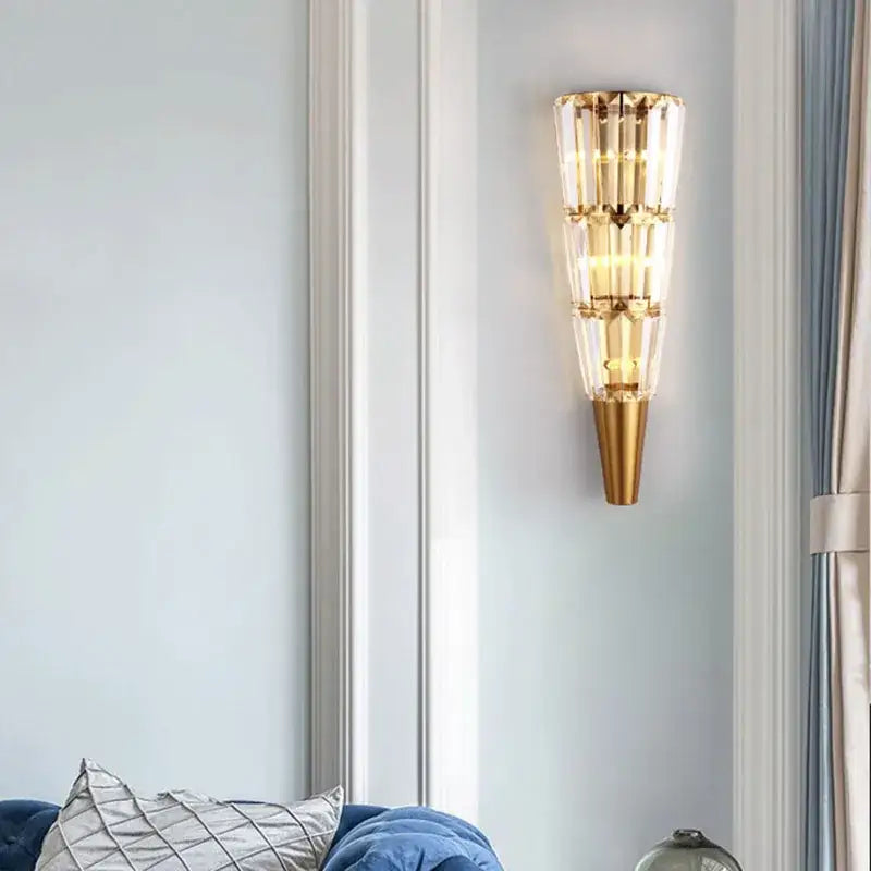Modern gold crystal torch wall lamp with stacked crystal tiers and conical base for living room decorbites crystal torch