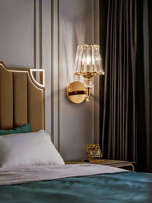 Modern gold crystal wall lamp featuring a gold-toned faceted sconce with crystal accents for elegant decorbites crystal wall decor