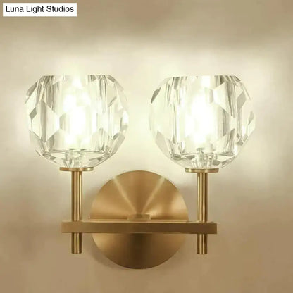 Brass-finished decorbites ivy wall lamp with two faceted crystal globe shades crystal wall lamp