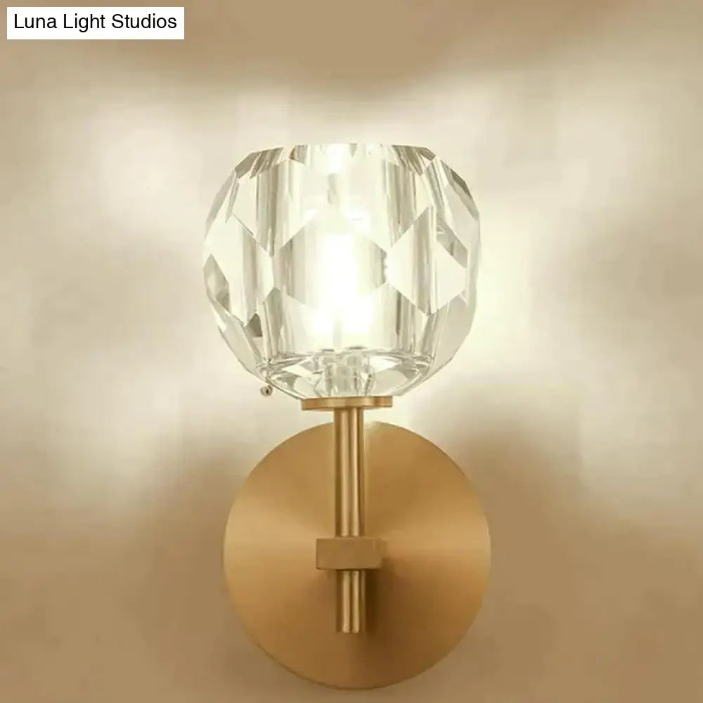 DecorBites™ ivy crystal wall lamp featuring a clear faceted crystal globe with a brushed brass base and stem