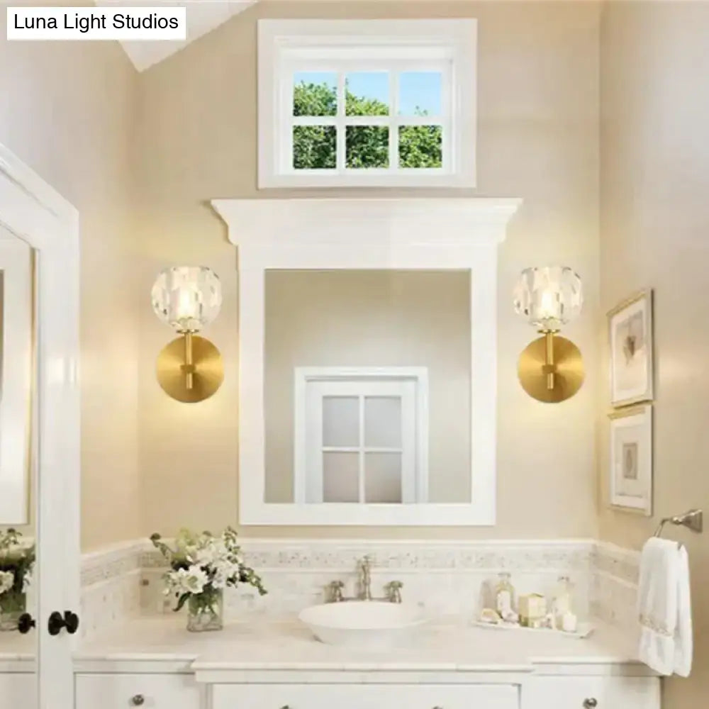 Gold-toned decorbites ivy crystal wall lamps with faceted crystal shades flank a white-framed bathroom mirror
