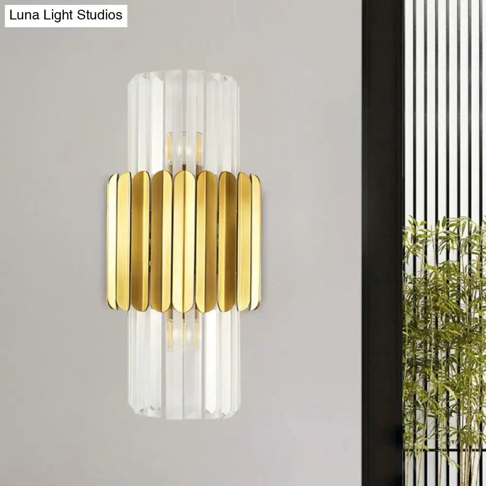 Modern gold crystal wall lamp featuring vertical clear glass rods and polished gold-toned metal band for bedroom use