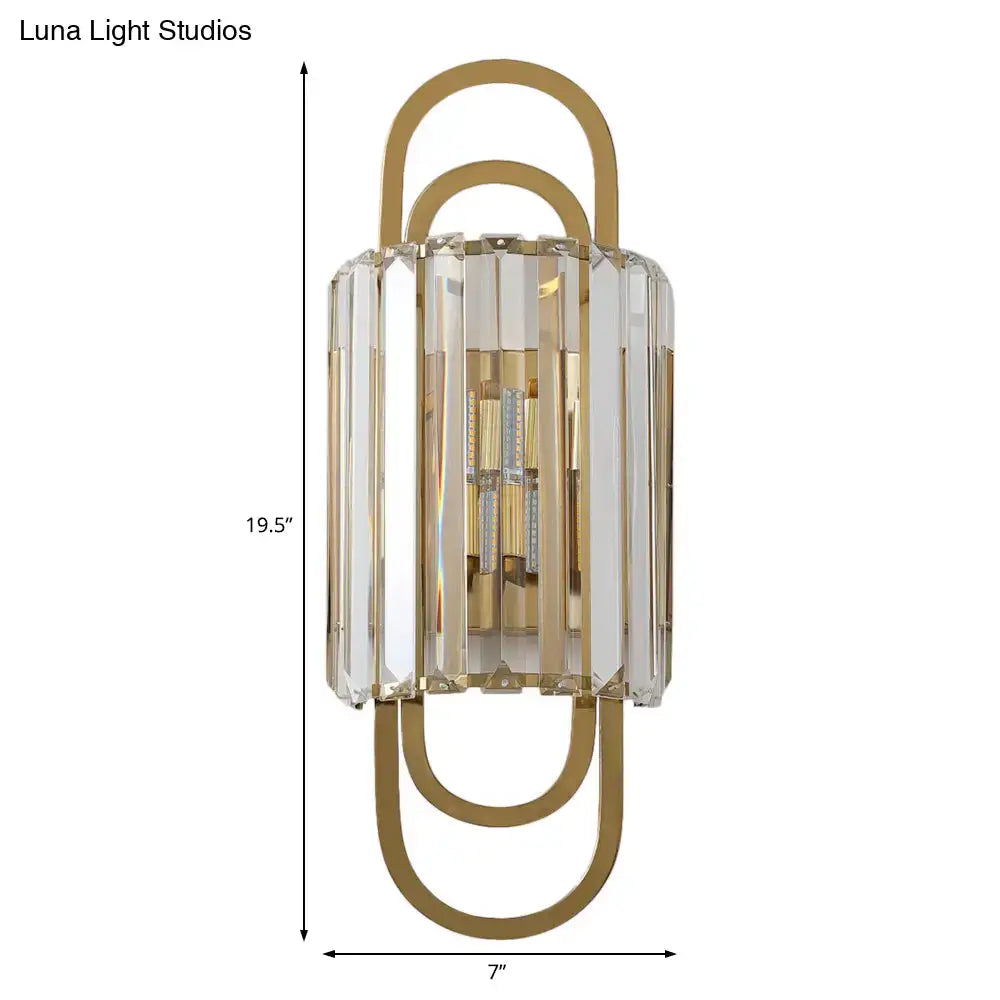 Modern gold-toned wall lamp with crystal bars and paperclip design in a minimalist style fixture for bedrooms