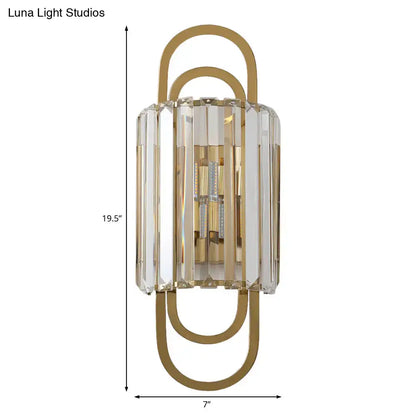 Modern gold-toned wall lamp with crystal bars and paperclip design in a minimalist style fixture for bedrooms
