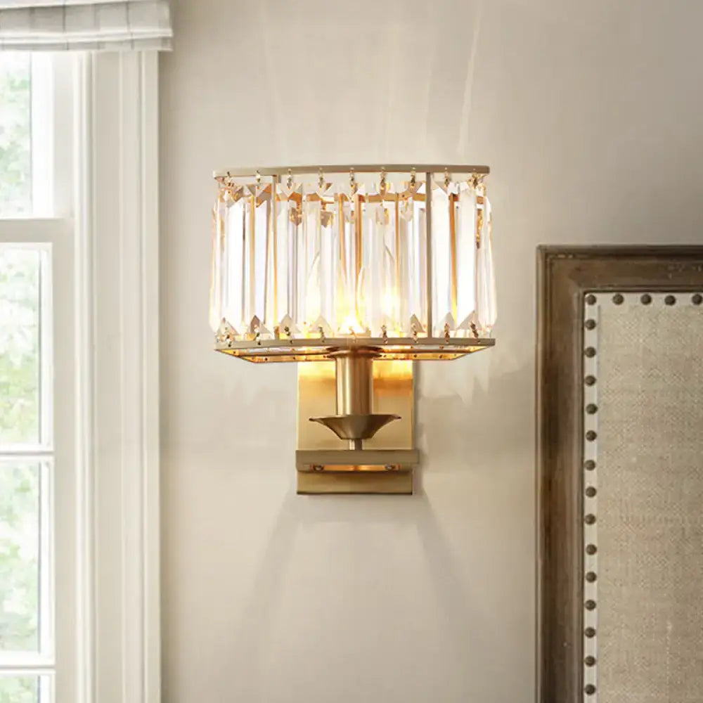 Gold-toned modern wall lamp with vertical crystal prisms and rectangular frame for 110v-120v and 220v-240v use