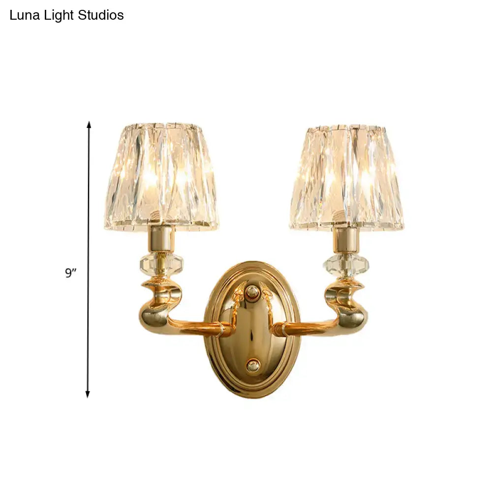 Modern gold wall light fixture with two crystal encrusted lampshades for bedroom lighting