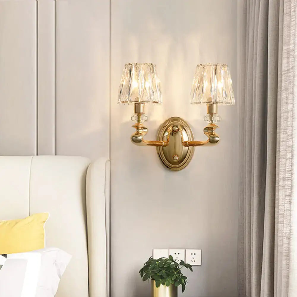 Modern gold crystal wall light fixture with two crystal-encrusted lampshades for bedroom lighting