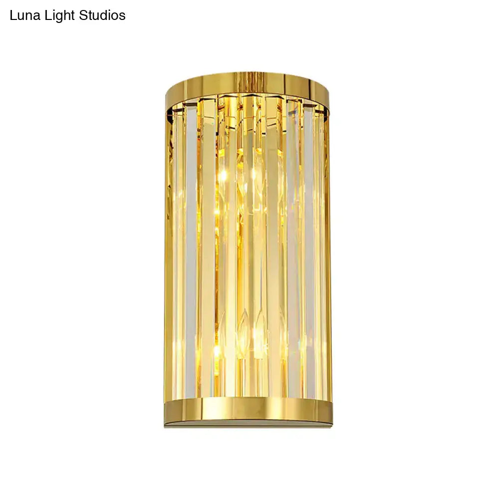 Modern gold crystal wall mount lighting featuring cylindrical design with vertical crystal rods for bedroom use