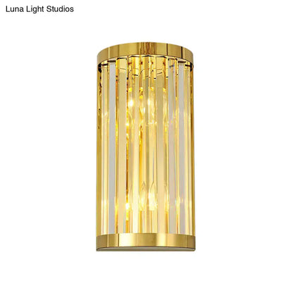Modern gold crystal wall mount lighting featuring cylindrical design with vertical crystal rods for bedroom use