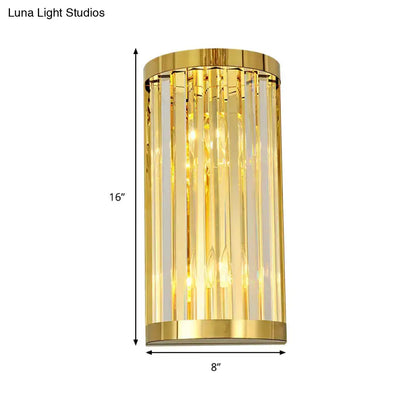Modern gold crystal wall mount lighting featuring cylindrical gold finish with vertical crystal rods bedroom sconce