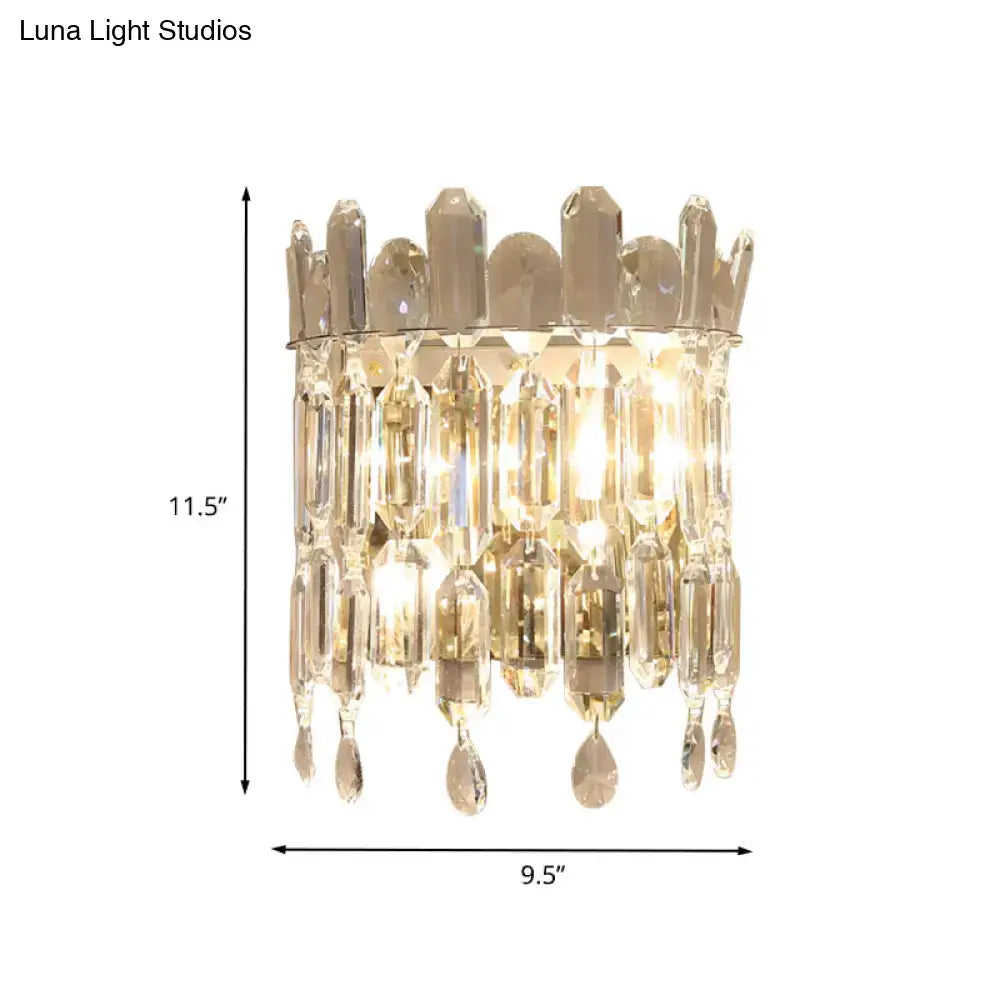 Modern gold crystal wall mount lighting with crown top and cascading teardrop crystals for living room sconce