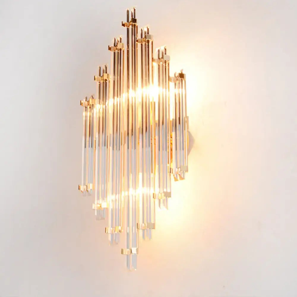 Modern gold wall mounted lamp with clear acrylic rods and brass accents for elegant living room lighting