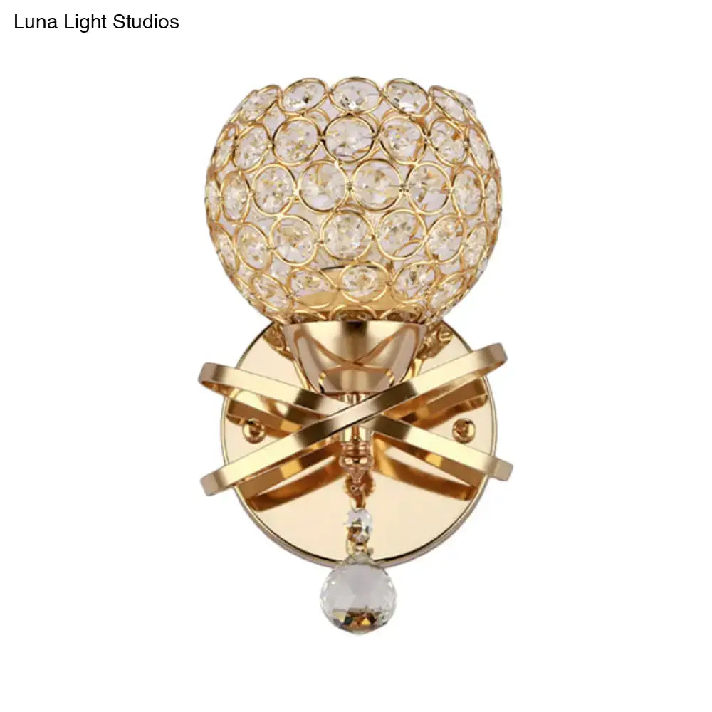 Modern gold crystal wall sconce with dropped crystal ball featuring clear faceted crystals and an elegant cross base wall light