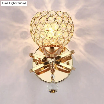 Modern gold crystal wall sconce with intersecting metallic bands and dropped crystal ball wall light for bedroom