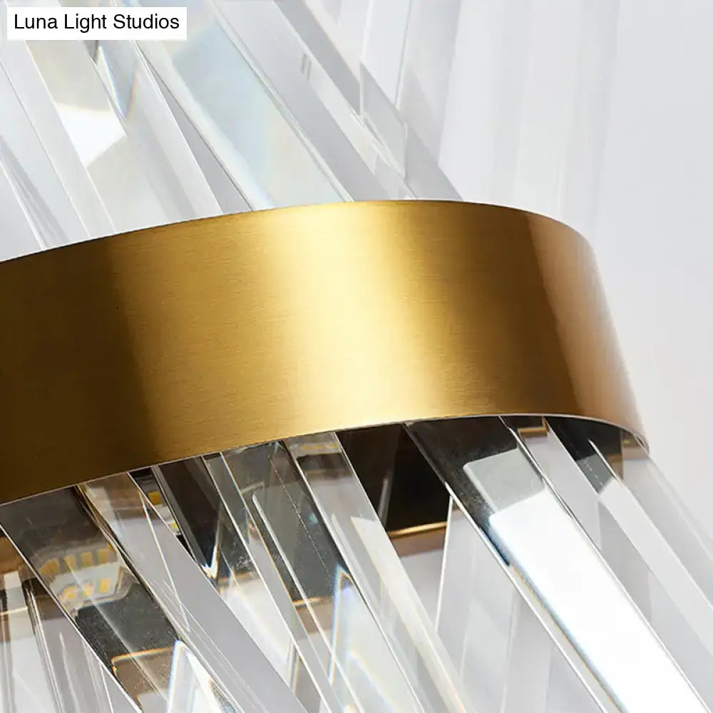 Modern gold crystal wall sconce with gold-toned metal band and clear crystal prisms for bedroom wall mount lamp