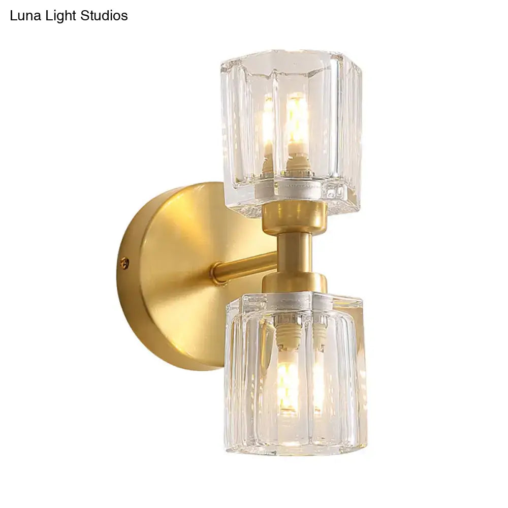 Modern gold crystal wall sconce with two clear faceted glass shades illuminated living room 2 inch fixture
