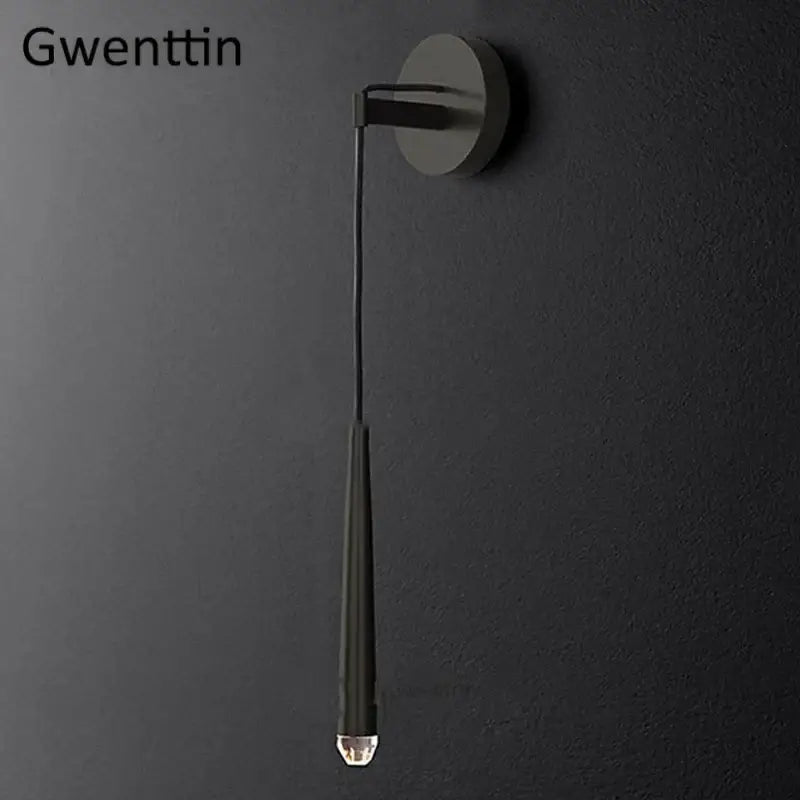 Modern matte black wall sconce with elongated cylindrical shade and crystal water drop accent for decorbites crystal water drop lighting