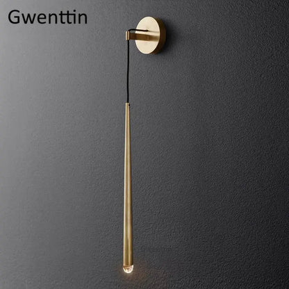 Modern gold crystal water drop wall sconce with sleek brass cylindrical design and warm glowing bulb for bedroom decorbites crystal water drop lighting
