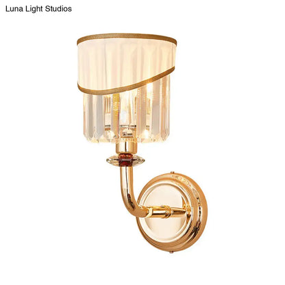 Modern gold curved arm wall light with e12 e14 base featuring fluted crystal shade and decorative gold trim bedroom sconce