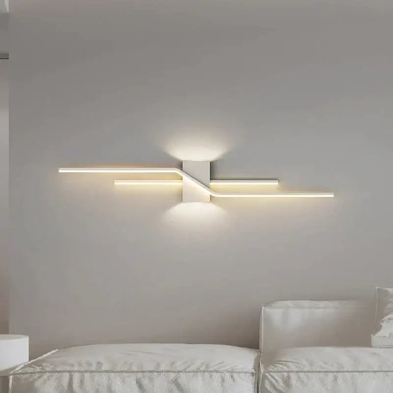 Modern white led wall lamp with sleek angular design and warm ambient lighting for bedroom decor