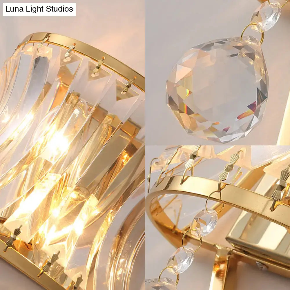 Modern gold curved wall light featuring clear crystal prism and dangling teardrop crystals for bedroom use
