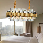 A modern decorbites traditional gold cut crystal chandelier light kit with 10 heads and alternating gold rods and prisms