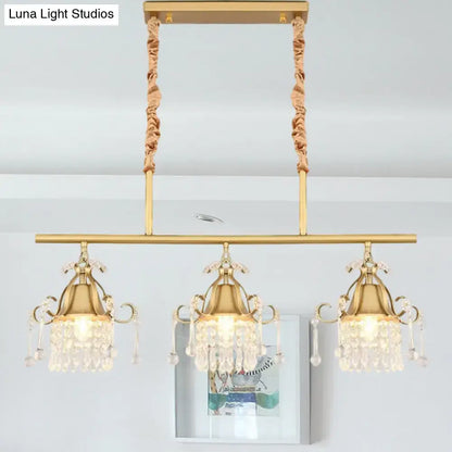 DecorBites™ crystal teardrop island pendant light with gold cylinder and three crystal-draped heads suspended by fabric cords
