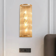 Modern gold cylinder wall mount lamp with vertical crystal rods featuring an elegant design for hallway lighting