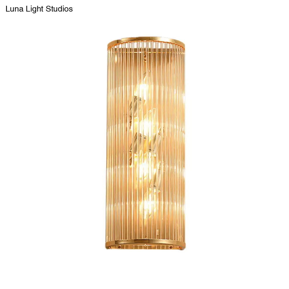 Modern gold cylinder wall mount lamp with vertical glass rods and crystal accents for elegant hallway lighting