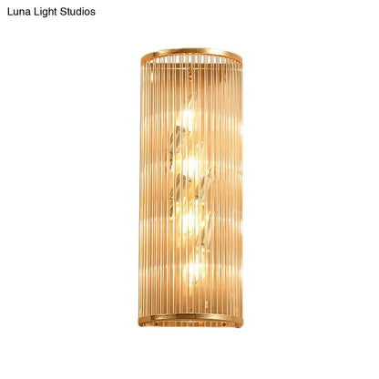 Modern gold cylinder wall mount lamp with vertical glass rods and crystal accents for elegant hallway lighting