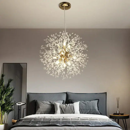 Modern gold dandelion art crystal chandelier with sparkling gold-toned branches suspended above a bed for decorbites dandelion art