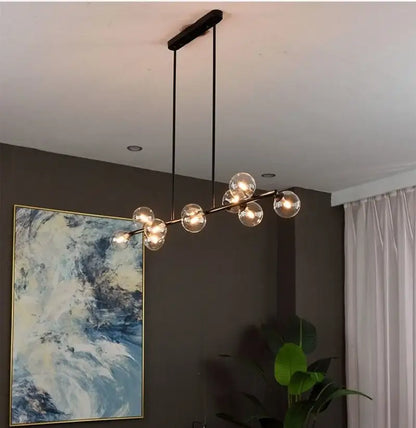 Modern black metal chandelier with clear glass globe bulbs for dining room featuring decorbites bubble ball led design