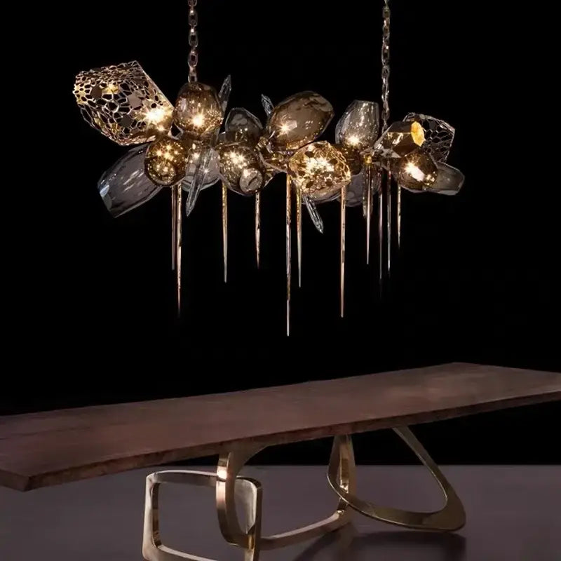A modern gold decorbites crystal duplex chandelier featuring clear glass orbs and metallic lattice for living room decor