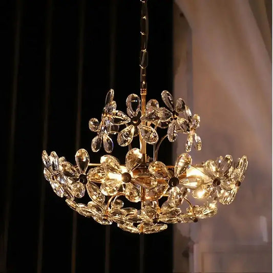 A modern gold decorbites crystal flower two-tiered chandelier with faceted crystals for living room decor