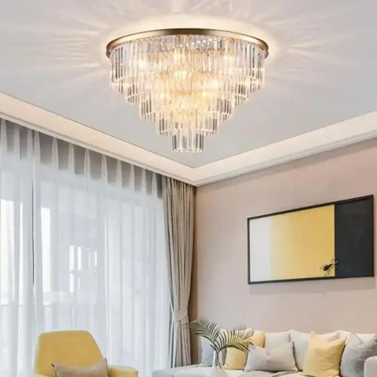 Modern gold decorbites crystal flush ceiling light with gold frame and cascading clear faceted crystals for bedroom