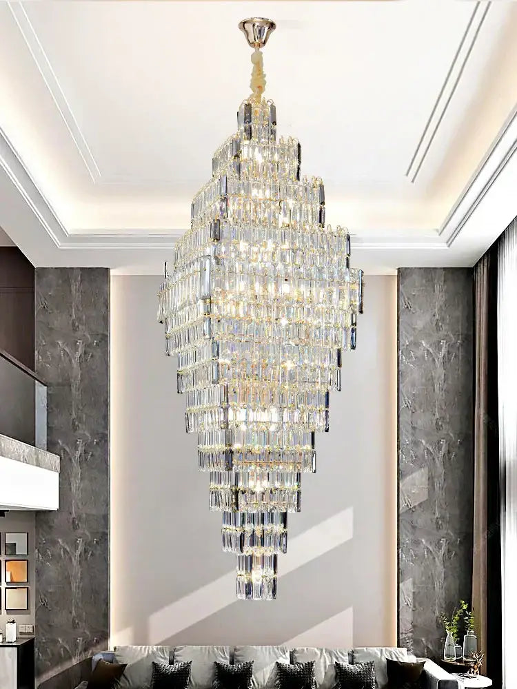 Modern gold decorbites crystal large chandelier with cascading clear glass prisms for elegant staircase pendant lighting