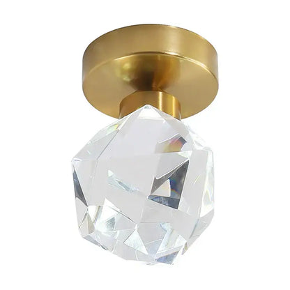 Modern gold decorbites crystal led ceiling light featuring a clear faceted crystal globe on a gold-toned metal base