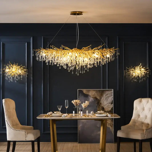 Modern gold decorbites crystal led chandelier with intricate branch design and dangling crystal droplets for dining room light