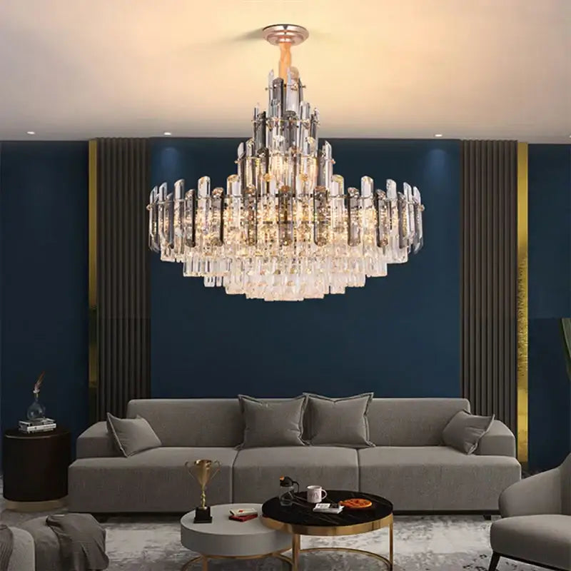 A modern decorbites crystal led chandelier with rose gold tiered glass and brass fixture for dining room