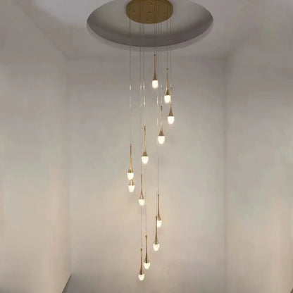 A modern gold decorbites crystal led chandelier with teardrop lights hanging from a circular ceiling mount