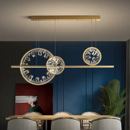 Modern gold decorbites crystal pendant chandelier with three circular crystal-encrusted lights for dining room lighting