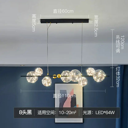 Modern black metal decorbites glass ball chandelier with eight clear globes and gold-toned accents for dining room