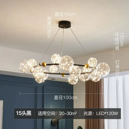 Modern black metal decorbites glass ball chandelier with 15 clear globes and gold-toned accents for dining room