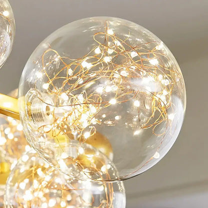 Clear glass globe pendant light with intricate golden filament string lights in modern decorbites glass ball chandelier