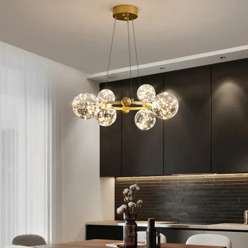Modern gold decorbites glass ball chandelier with multiple clear glass spheres for dining room lighting