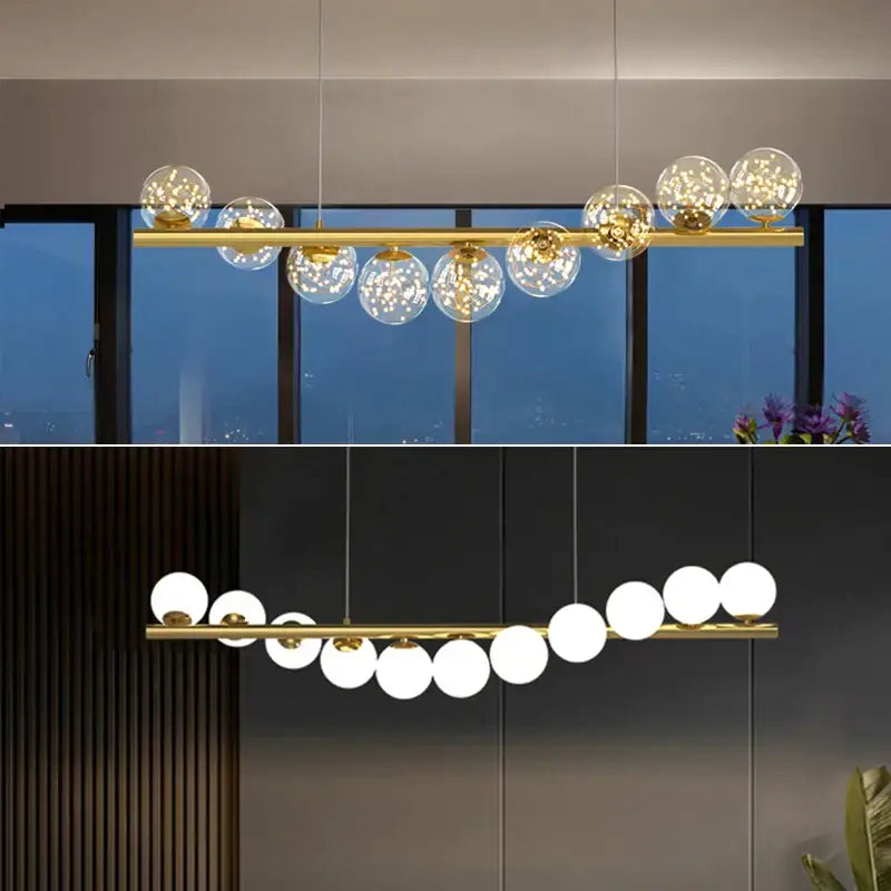 Modern gold decorbites glass balls chandelier features a gold-toned linear frame with clear glass globe shades and warm led lighting
