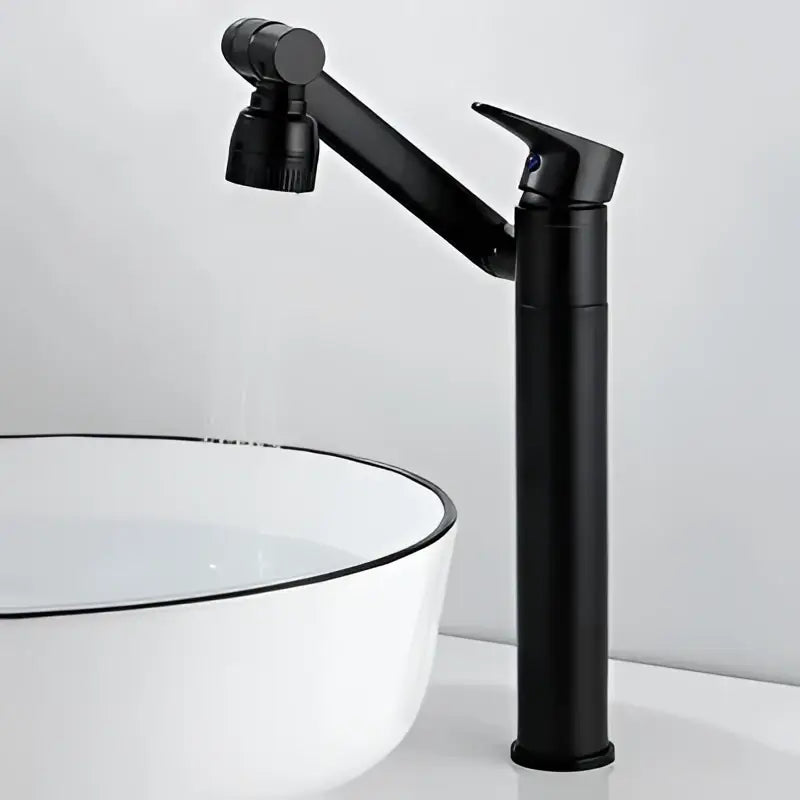 Modern gold bathroom sink faucet with a sleek black matte finish and an articulated pull-down spray head for bathroom sink use
