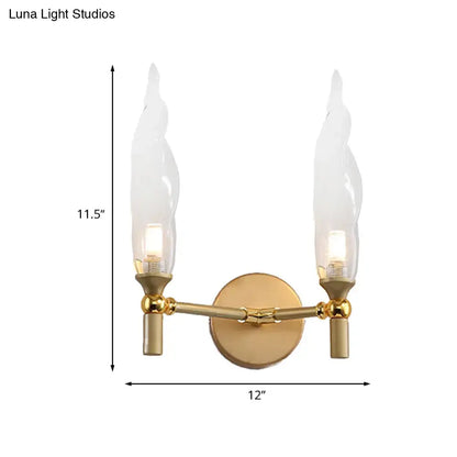 Modern gold double arm wall sconce with two flame-shaped glass shades for living room wall lighting